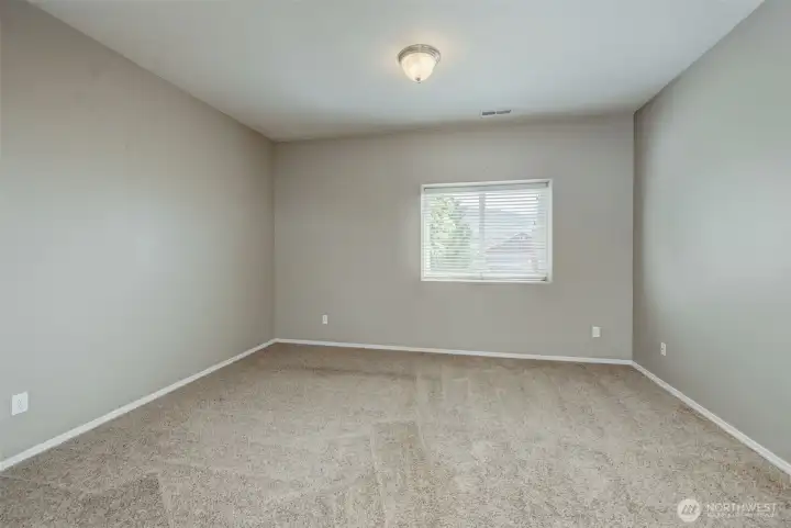 Lower-level bedroom offering flexibility for guests, office space, or hobbies. Lower-level bedroom offering flexibility for guests, office space, or hobbies.