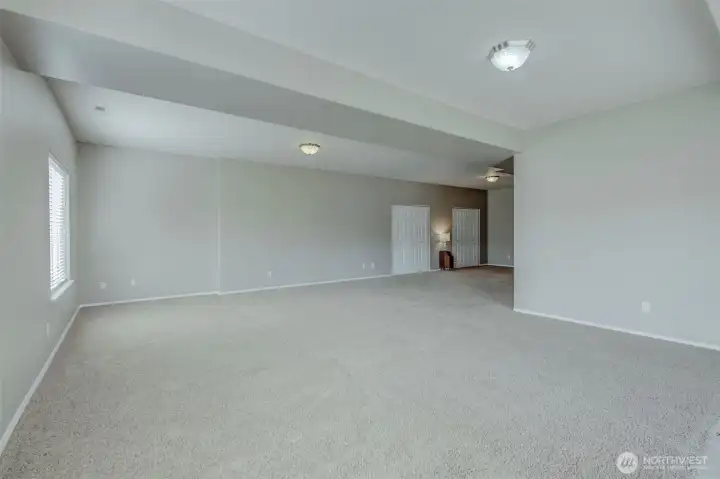 Expansive family room creating the perfect secondary gathering and entertainment space. Expansive family room creating the perfect secondary gathering and entertainment space.