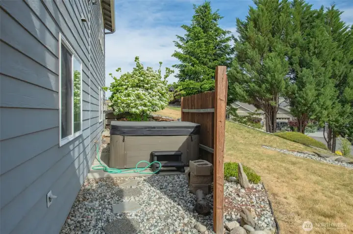 Private hot tub area with fencing designed for relaxation and peaceful evenings. Private hot tub area with fencing designed for relaxation and peaceful evenings.