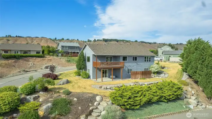 Beautiful rear exterior highlighting deck, landscaping, and elevated views. Beautiful rear exterior highlighting deck, landscaping, and elevated views.