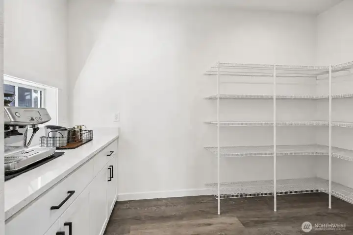 Generous walk-in pantry.