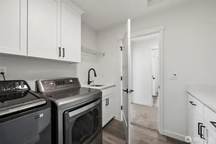 Laundry room with utility sink.