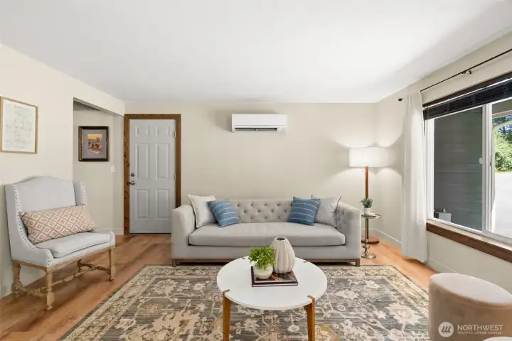 In the living room, the mini-split system offers efficient heating and cooling options. In the living room, the mini-split system offers efficient heating and cooling options.