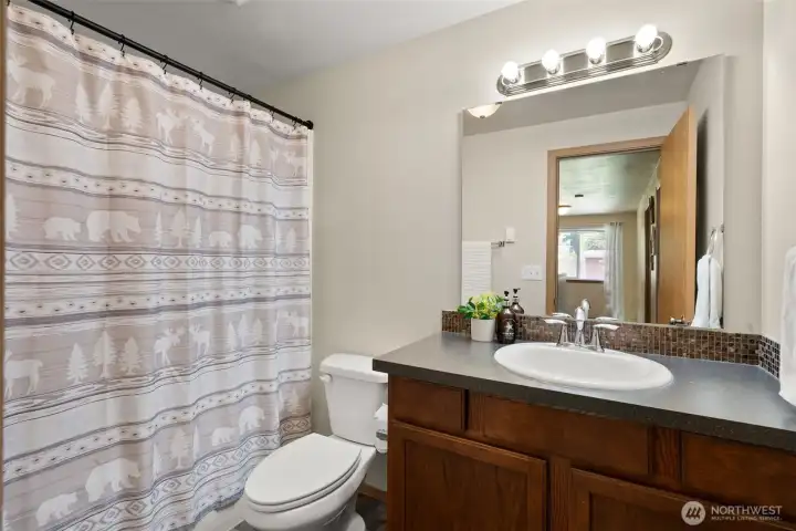 Another full bathroom upstairs adds to the functionality of this home for many. Another full bathroom upstairs adds to the functionality of this home for many.