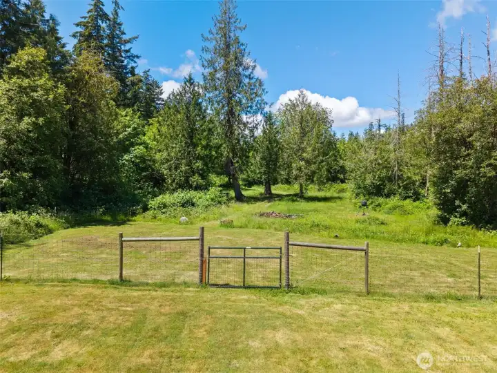 The top and bottom portions of the yard are separated by fencing - perfect for pets, children, and animals. The top and bottom portions of the yard are separated by fencing - perfect for pets, children, and animals.