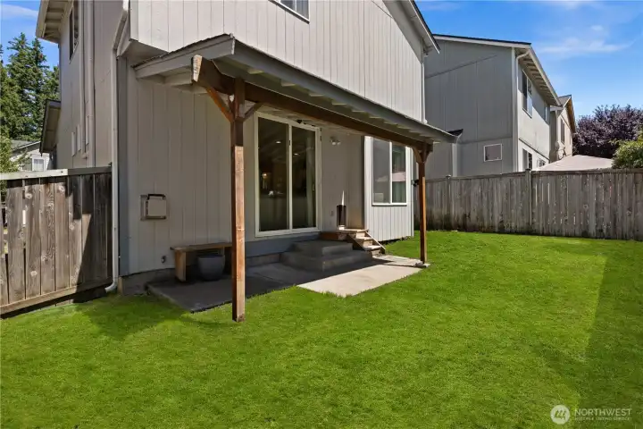 Fully fenced backyard and covered patio Fully fenced backyard and covered patio