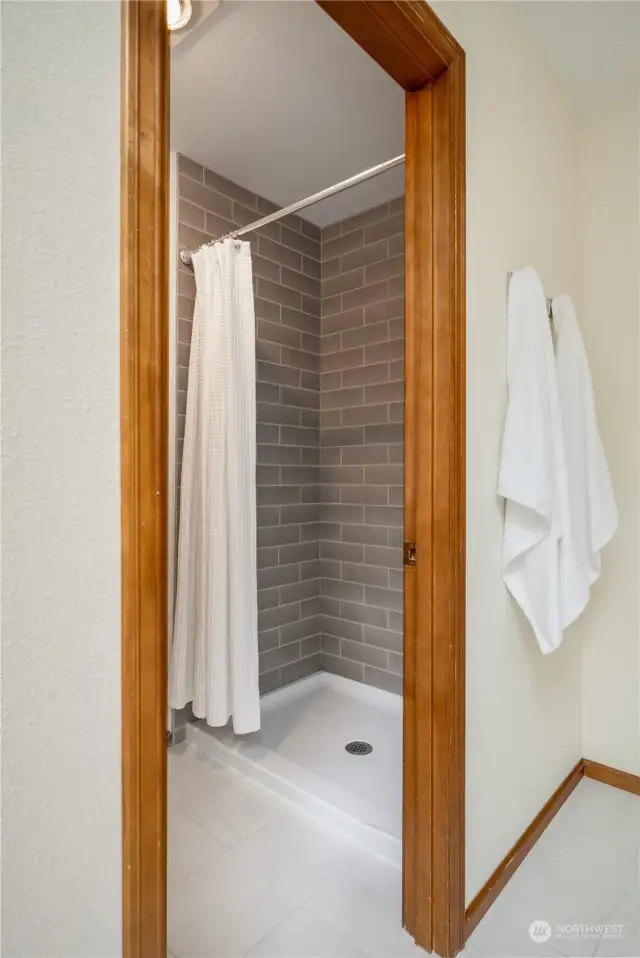 Shower is set apart from tub and vanity!