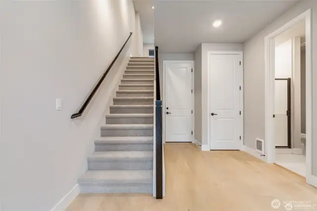 1st flr view to garage, bdrm, 3/4ba and upstairs level 2