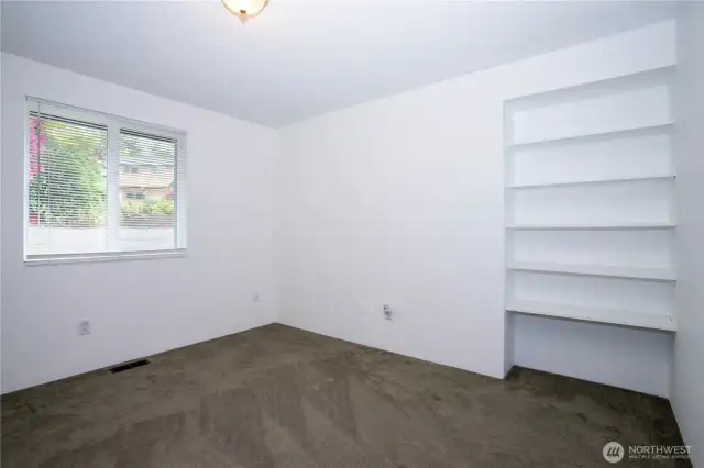 The built in shelving is in addition to existing closet in this bedroom.