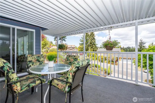 Covered deck adjacent from the living room as well as family room.