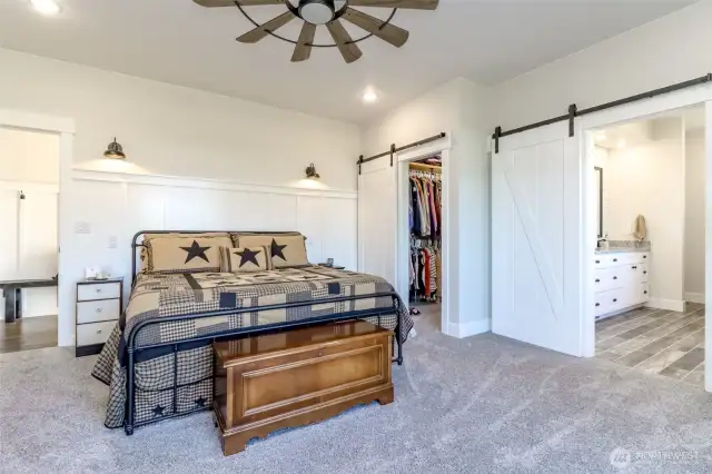 Main Floor Primary Bedroom with Custom barn doors and walk in closet