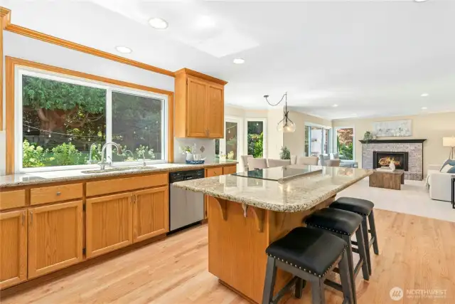 Stainless steel appliances and newly refinished oak floors.