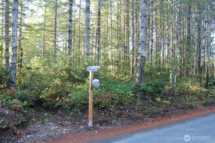 Smaller piece with sign for NE D and J Trl Road