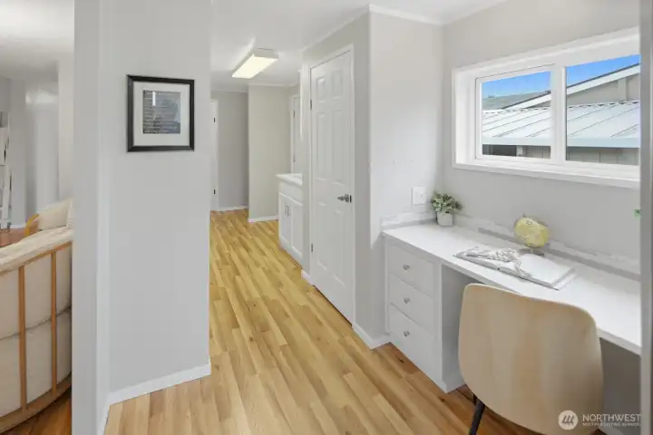 Built-in coffee bar/desk with quartz counter and glass backsplash