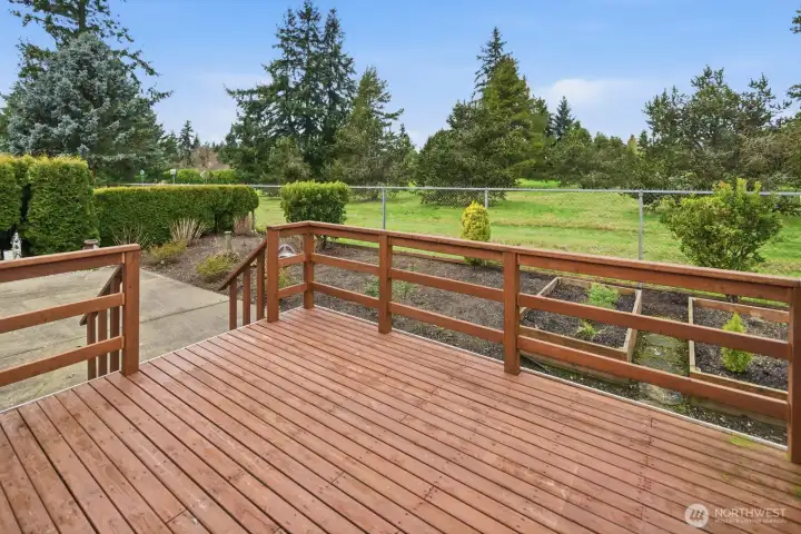 Entertainment-size deck overlooking your planter beds and golf course