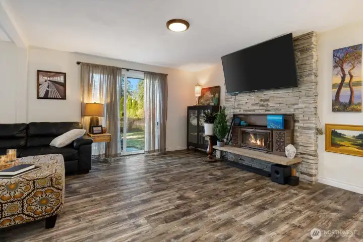Large living room with wood stove.