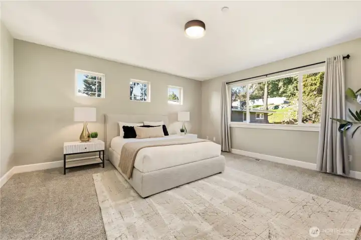 This generous primary suite provides space to relax and retreat at the end of a long day