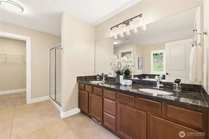 Enjoy dual vanities in the 5 piece ensuite primary bathroom with a separate shower and walk-in closet