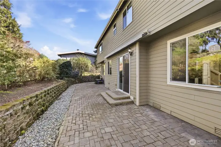 The back patio is perfect for setting up the grill and soaking up summer days