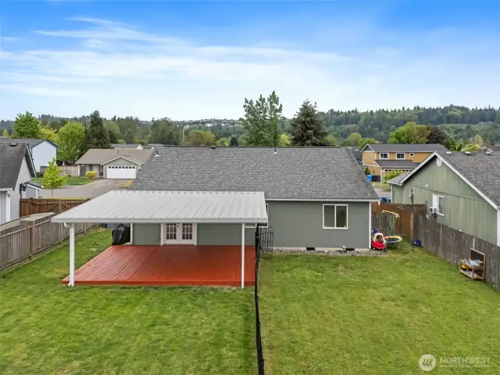 Back of home with covered patio