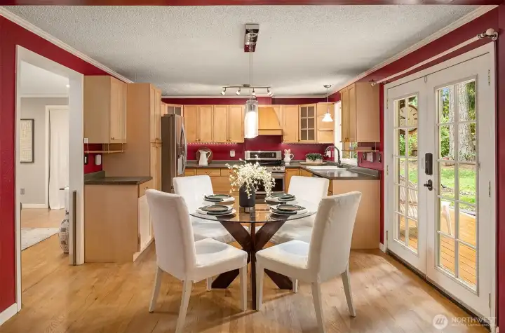Dining Area with French doors leading to the large deck. Dining Area with French doors leading to the large deck.