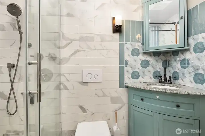 Remodeled 3/4 hall bath with custom tile. Remodeled 3/4 hall bath with custom tile.