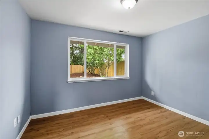 Northwest bedroom with west-facing window, unstaged.