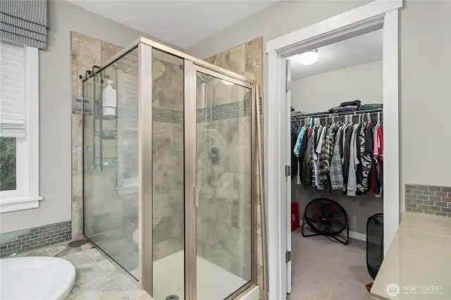 Shower, walk in closet and notice the additional counter/storage on the right