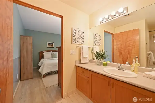 The bathroom features a roomy vanity with ample counter space.