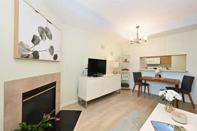 For a cozy, inviting touch, the living room features a fireplace.