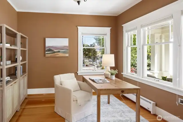 Looking thru French doors into home office, or other activity space  - windows to rt face front porch