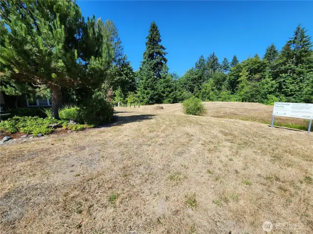 SW corner is ahead to real estate sign