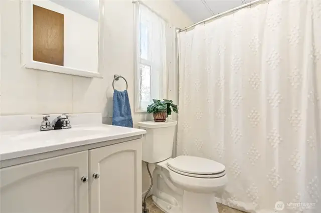 Primary bathroom with updated walk-in shower.