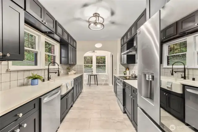 Quartz countertops, shaker cabinets and brand new appliances