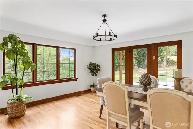 Large dining room with room to host friends and family while natural light pours through the windows