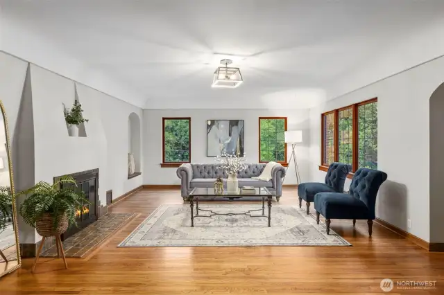 Open and bright living area with wood burning fireplace