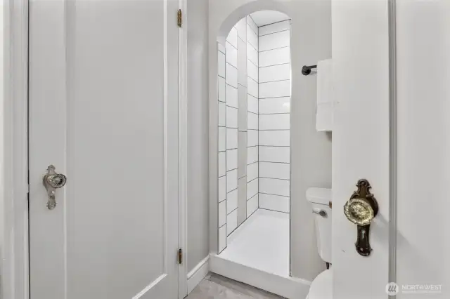 3/4 bathroom on main floor with custom tiled shower