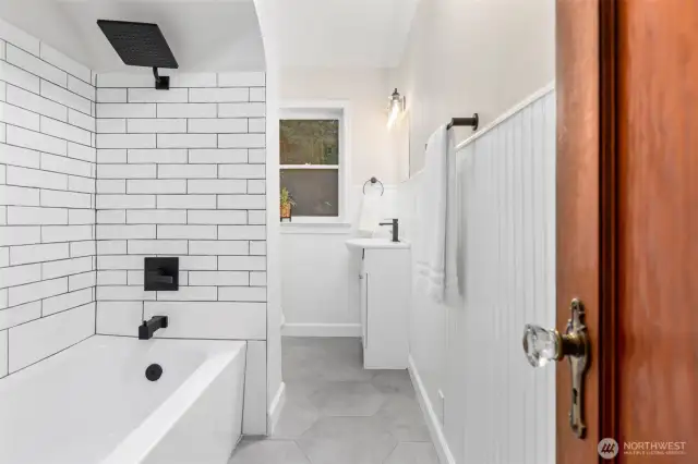 Upstairs full bathroom with tiled shower