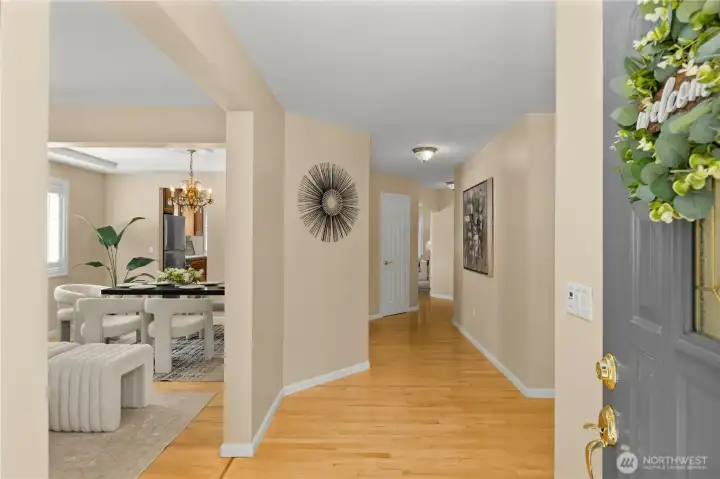 Welcoming front entry with elegant finishes and hardwood floors throughout