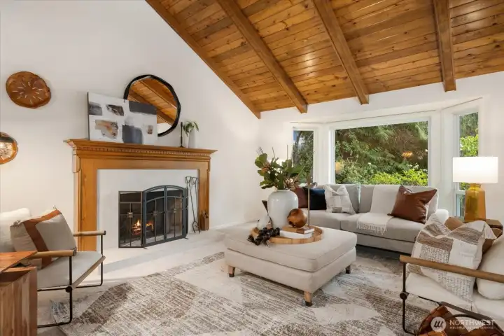 Previously staged. Soaring vaulted fir ceilings create an inviting space to gather.