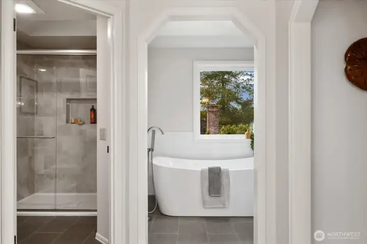 Skylight extends over both shower and luxurious soking tub