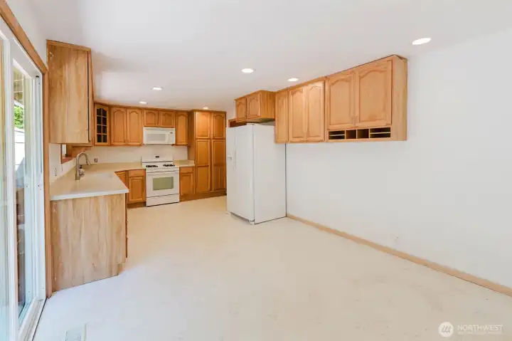 Kitchen with ample storage. Heavy wood cabinets