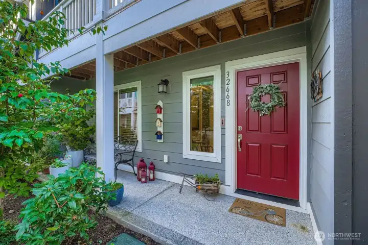 Charming front patio and door greets you.