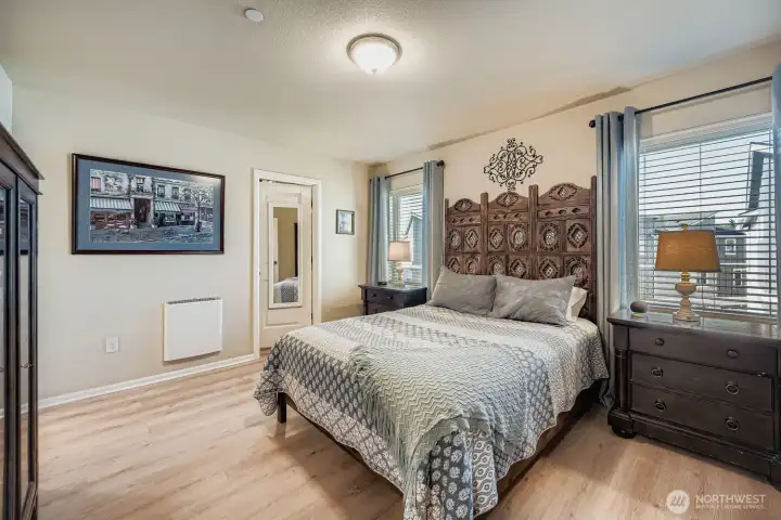 Upstairs, primary suite has a walk-in closet and private bath.