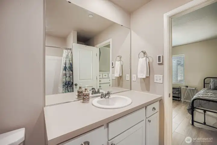 Full bathroom located within bedroom.