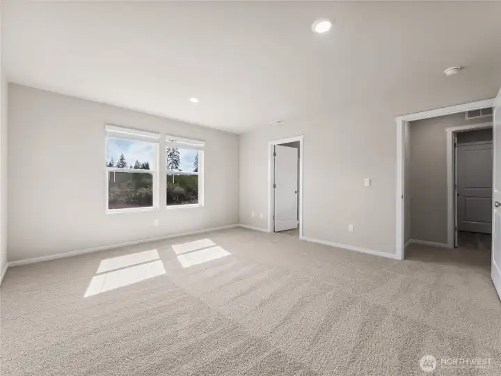 Primary bedroom leads to ensuite.  Finishes and options will vary.