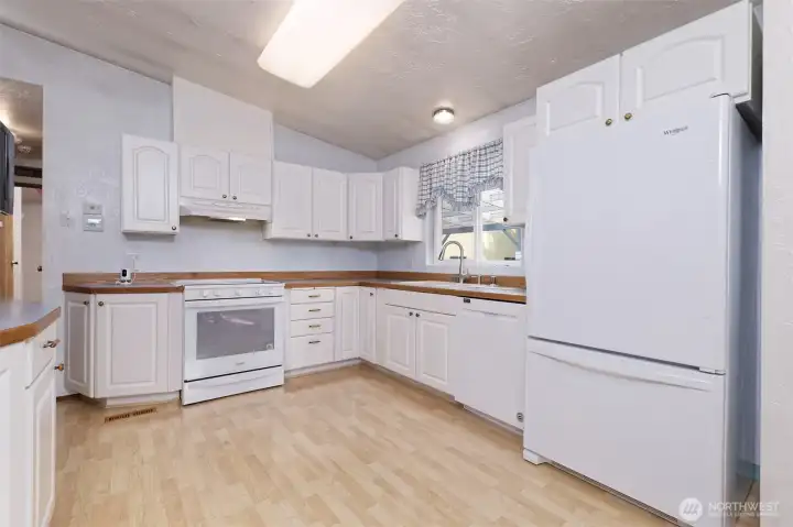 Nice sunny and bright kitchen with lots of storage.