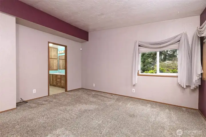 Primary bedroom with en suite bathroom.