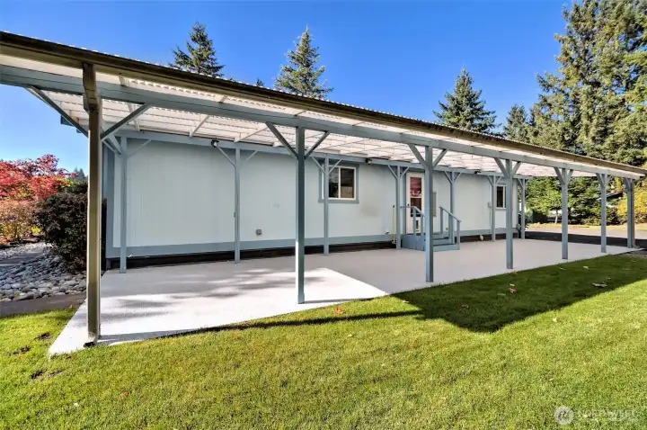 This covered back patio has welcomed family and friends for decades. Many happy memories here!