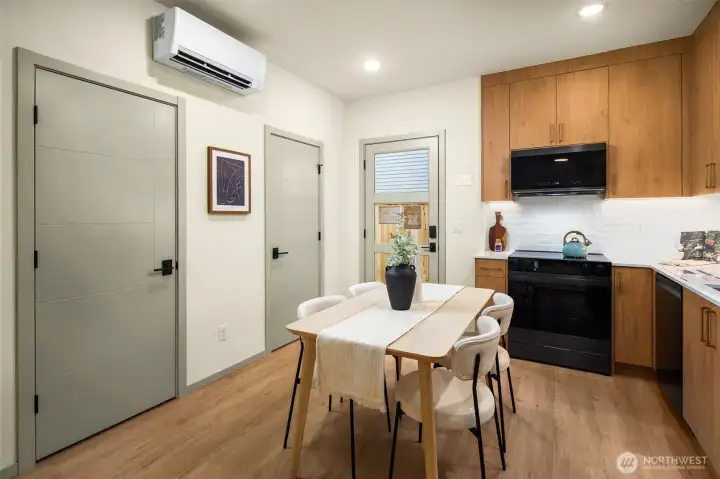 Versatile dining space equipped with a ductless mini-split for year-round climate control and comfort.